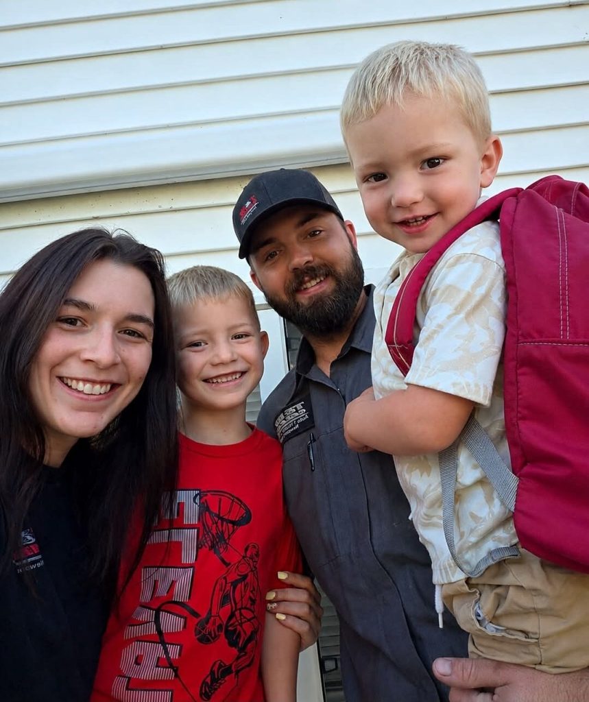 Nick and Caitlyn Brown, owners of T&W Garage, with their two sons