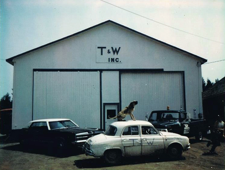 The original T&W Inc. garage building with company vehicles